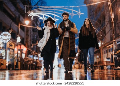 Group of young adults walking together on an illuminated city street at night, showcasing urban lifestyle and friendship.