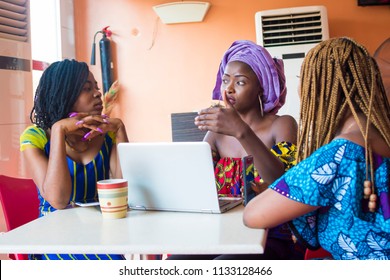 Group Of Young African Women Discussing Something Important. Three African Women Discussing Business. Group Of Young Women Discussing Together 