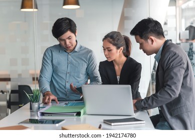 Group Of Young Asian Business People Brainstorm Collaboration Ideas At The Office.