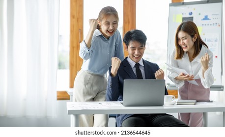 Group of Young Asian business team creative businesspeople coworker in office Happy to be successful partnership teamwork celebrating achievement and success concept. - Shutterstock ID 2136544645