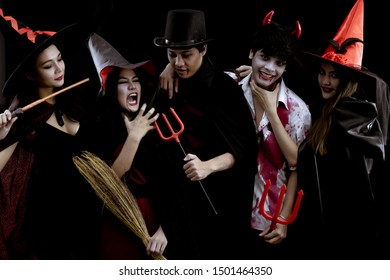 Group Young Asian In Costume Halloween Party On Black Background With Concept For Halloween Fashion Festival In Studio. Gang Of Teen Asian In Cosplay Halloween. Costume Ghost, Evil Of Group Teen Thai.
