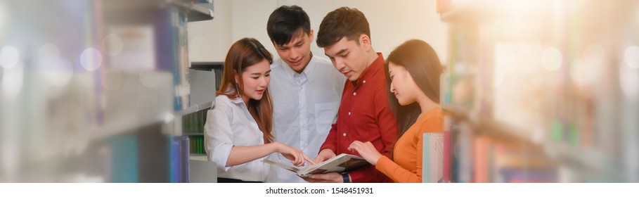 Group of young asian friends meeting in library room. Education workshop class, Asian knowledge development concept. space for text background.