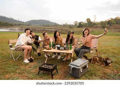 Group of young  Asian people are enjoy camping in natural campsite - Powered by Shutterstock