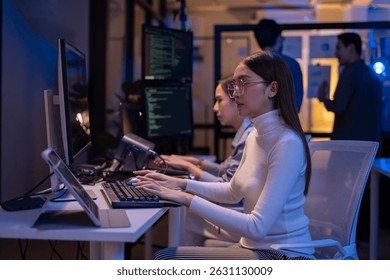 Group of young Asian Software Developers Talk,Discuss a Technological Project prompt app program nomad AI.Ux and Ui Developer Designer brainstorming algorithms on computer screen in office.