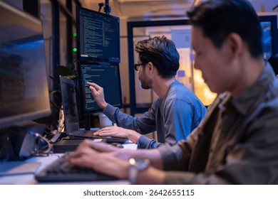 Group of young Asian Software Developers Talk,Discuss a Technological Project prompt app program nomad AI.Ux and Ui Developer Designer brainstorming algorithms on computer screen in office.