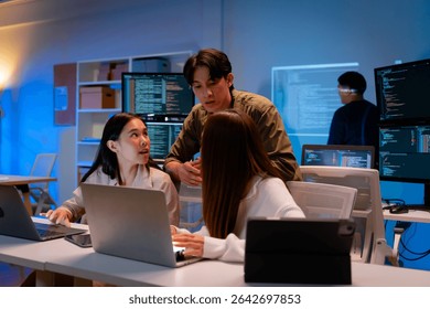 Group of young Asian Software Developers Talk,Discuss a Technological Project prompt app program nomad AI.Ux and Ui Developer Designer brainstorming algorithms on computer screen in office.