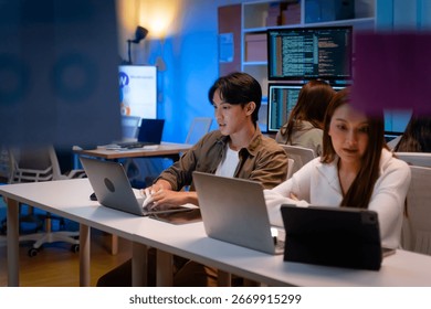 Group of young Asian Software Developers Talk,Discuss a Technological Project prompt app program nomad AI.Ux and Ui Developer Designer brainstorming algorithms on computer screen in office.