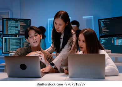 Group of young Asian Software Developers Talk,Discuss a Technological Project prompt app program nomad AI.Ux and Ui Developer Designer brainstorming algorithms on computer screen in office