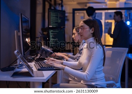 Group of young Asian Software Developers Talk,Discuss a Technological Project prompt app program nomad AI.Ux and Ui Developer Designer brainstorming algorithms on computer screen in office.