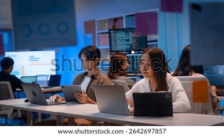 Group of young Asian Software Developers Talk,Discuss a Technological Project prompt app program nomad AI.Ux and Ui Developer Designer brainstorming algorithms on computer screen in office.
