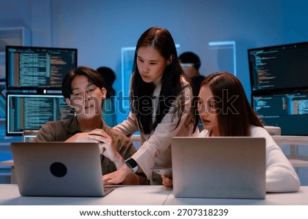 Group of young Asian Software Developers Talk,Discuss a Technological Project prompt app program nomad AI.Ux and Ui Developer Designer brainstorming algorithms on computer screen in office
