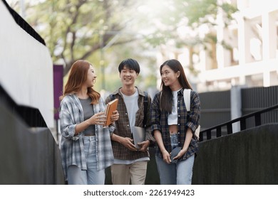 Group of Young Asian student walking and talking at university before class room. education, back to school concept - Powered by Shutterstock