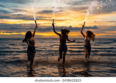 Group of Young Asian woman dancing and playing sparklers firework together at tropical island beach in summer night. Attractive girl enjoy and fun outdoor lifestyle travel ocean on holiday vacation. - Powered by Shutterstock