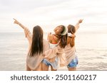 Group of Young Asian woman enjoy and fun outdoor lifestyle travel nature ocean on summer beach holiday vacation. Attractive girl friends walking and playing together at the sea on tropical island.