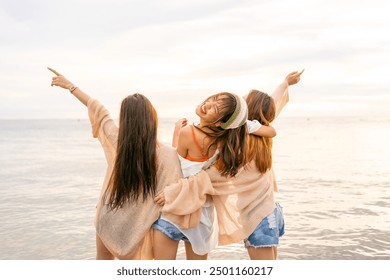 Group of Young Asian woman enjoy and fun outdoor lifestyle travel nature ocean on summer beach holiday vacation. Attractive girl friends walking and playing together at the sea on tropical island. - Powered by Shutterstock