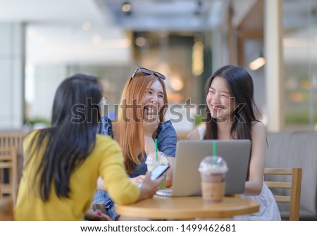 group of young asian woman enjoy talking chatting easy life in cafe shop in holidays, happy meeting in group breaking for coffee time