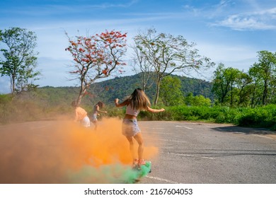 Group Of Young Beautiful Asian Woman Skateboarding Together At Skate Park On Summer Vacation. Happy Active Female Friends Enjoy Outdoor Activity Lifestyle And Extreme Sport Surf Skate At Public Park.