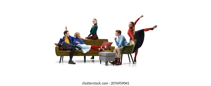 Group Of Young Beautiful Graceful Men And Women Sitting On Sofa Isolated On White Studio Background. Concept Of Fashion, Beauty, Youth Culture, Retro Style, Friendship. Facial Expression, Feelings.