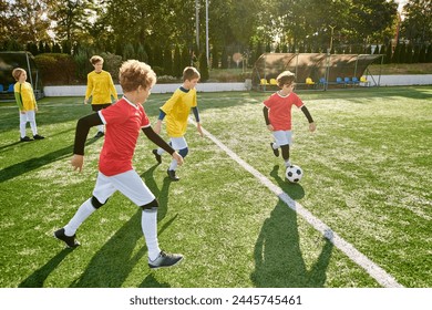 A group of young boys enthusiastically playing a game of soccer on a green field. They are running, kicking the ball, and cheering each other on, displaying teamwork and sportsmanship. - Powered by Shutterstock