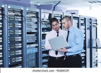 group of young business people it engineer in network server room solving problems and give help and support