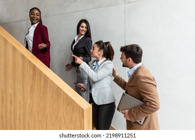 Group Of Young Business People Going To Cafeteria On Lunch Break To Eat And Drink Coffee After Successful Day At Work. Office Workers Going Home After Working On New Project.