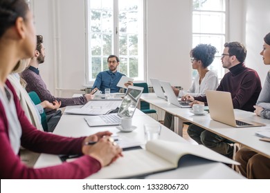 Group Of Young Business People Having A Meeting At The Modern Office Space.