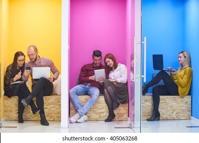 Group Of Young Business People Having Fun, Relaxing And Working In Creative Room Space At Modern Startup Office