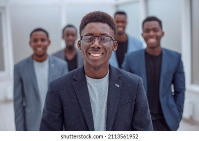 Group Of Young Business People Standing In The Office Lobby.