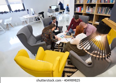 group of young business people , Startup entrepreneurs working on their venture in coworking space - Shutterstock ID 404989825
