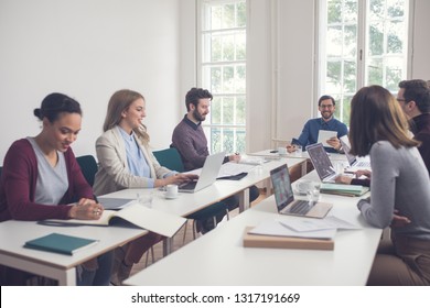 Group of young business people working at the modern office space. - Shutterstock ID 1317191669