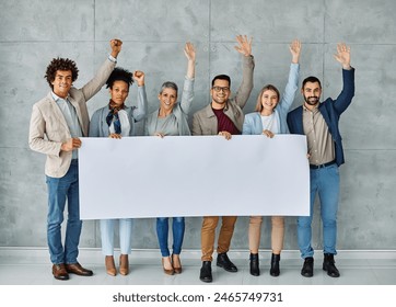 Group of young businesspeople holding large blank white sign in office - Powered by Shutterstock