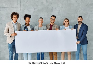 Group of young businesspeople holding large blank white sign in office - Powered by Shutterstock