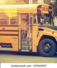 A Group Of Young Children Getting Off The Schoolbus