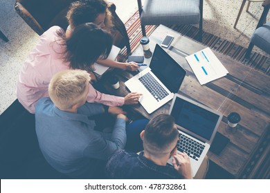 Group Young Coworkers Making Great Business Decisions.Creative Team Discussion Corporate Work Concept Modern Office.New Startup Marketing Idea Presentation.Woman Touching Digital Laptop.Top View