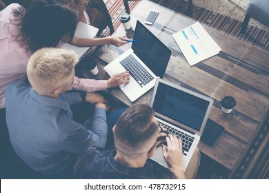 Group Young Coworkers Team Making Excellent Business Decisions.Creative People Discussion Corporate Work Concept Modern Office.New Startup Marketing Idea Presentation.Woman Touching Laptop.Top View