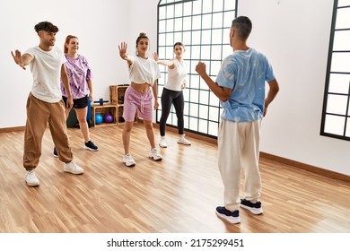 Group Of Young Dancer Smiling Happy Dancing Choreography At Dance Academy.