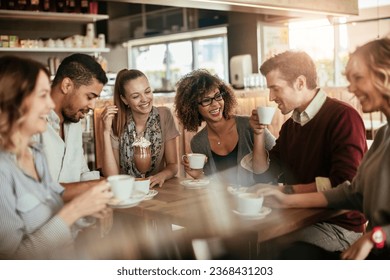 Group of young and diverse friends having coffee together in a cafe or bar - Powered by Shutterstock