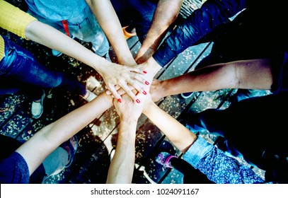 Group Of Young Diversity Student College In Volunteer Community Holding Hands Stack Together Show Powerful Of Teamwork And Working Together. Multi Ethnic Hands People In Team Of Multiple Human Culture