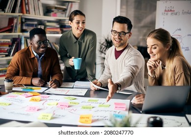 Group of young entrepreneurs analyzing mind map on paperboard while working on new business project at casual office.  - Powered by Shutterstock