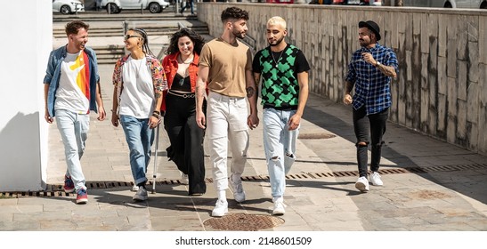 Group Of Young Fashionable Friends Spending Time Together In The City, Walking, Talking And Smiling. Six People. Friendship. Happiness. Real People Lifestyle. 
