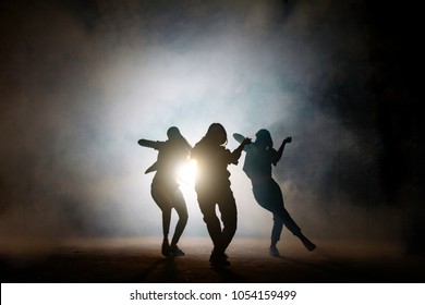 Group Of Young Female Dancers On The Street At Night. Common Interests. Favourite Pastime. Dancing Together