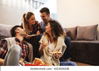 Group Of Young Friends Eating Pizza.Home Party.Fast Food Concept.