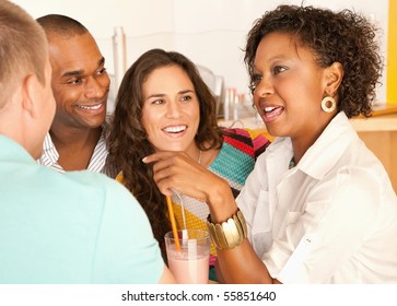 A group of young friends enjoy a conversation over smoothies.  Horizonal shot. - Powered by Shutterstock