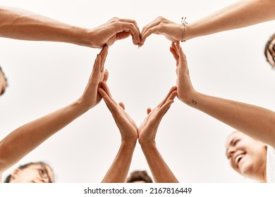 Group of young friends with hands together doing heart symbol. - Powered by Shutterstock