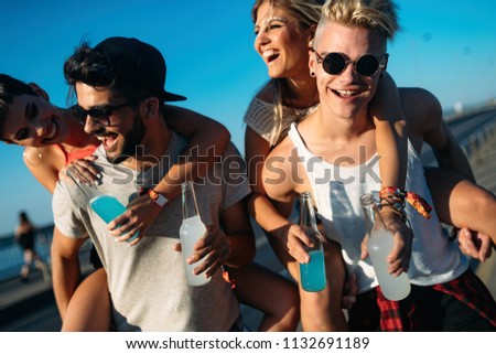 Group of young friends having fun together