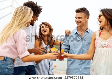 Similar – Image, Stock Photo Group of young people having fun in summer party