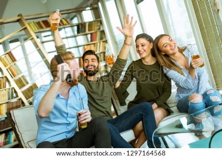 Similar – Image, Stock Photo Young business people on the roof terrace at the Afterwork Beer