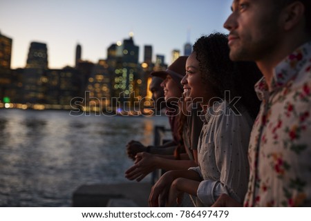 Group Of Young Friends On Trip To Manhattan At Dusk