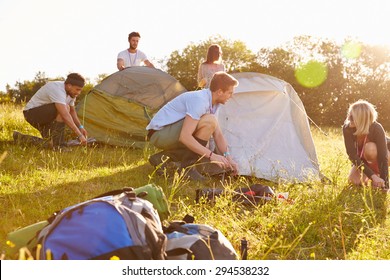 Group Of Young Friends Pitching Tents On Camping Holiday - Shutterstock ID 294538232