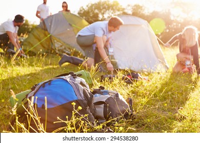 Group Of Young Friends Pitching Tents On Camping Holiday - Shutterstock ID 294538280